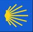 Das Symbol für den Jakobsweg. Eine stilisierte Jakobsmuschel in Gelb auf blauem Grund.